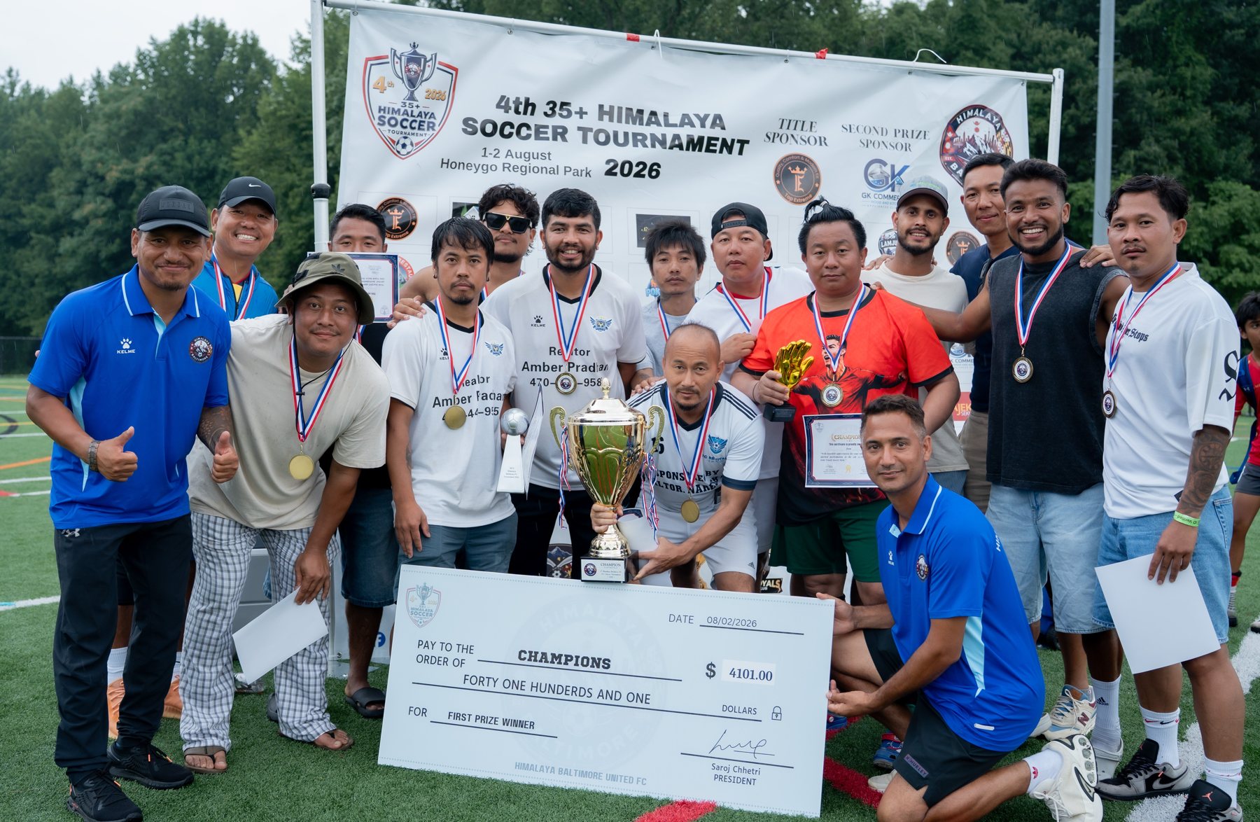 FC Revival players celebrating with the championship trophy
