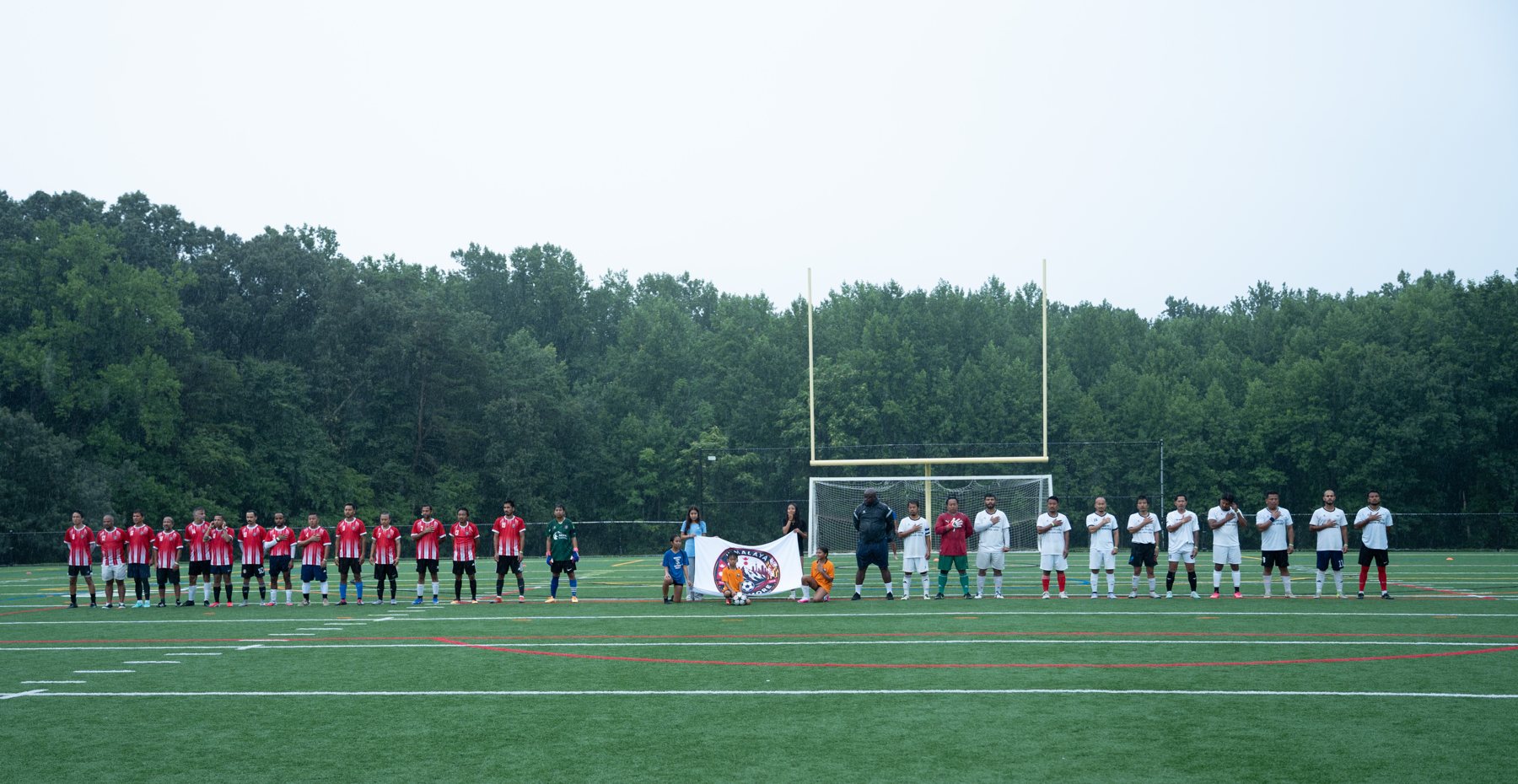 The finalists lined up before kickoff for a moment of remembrance