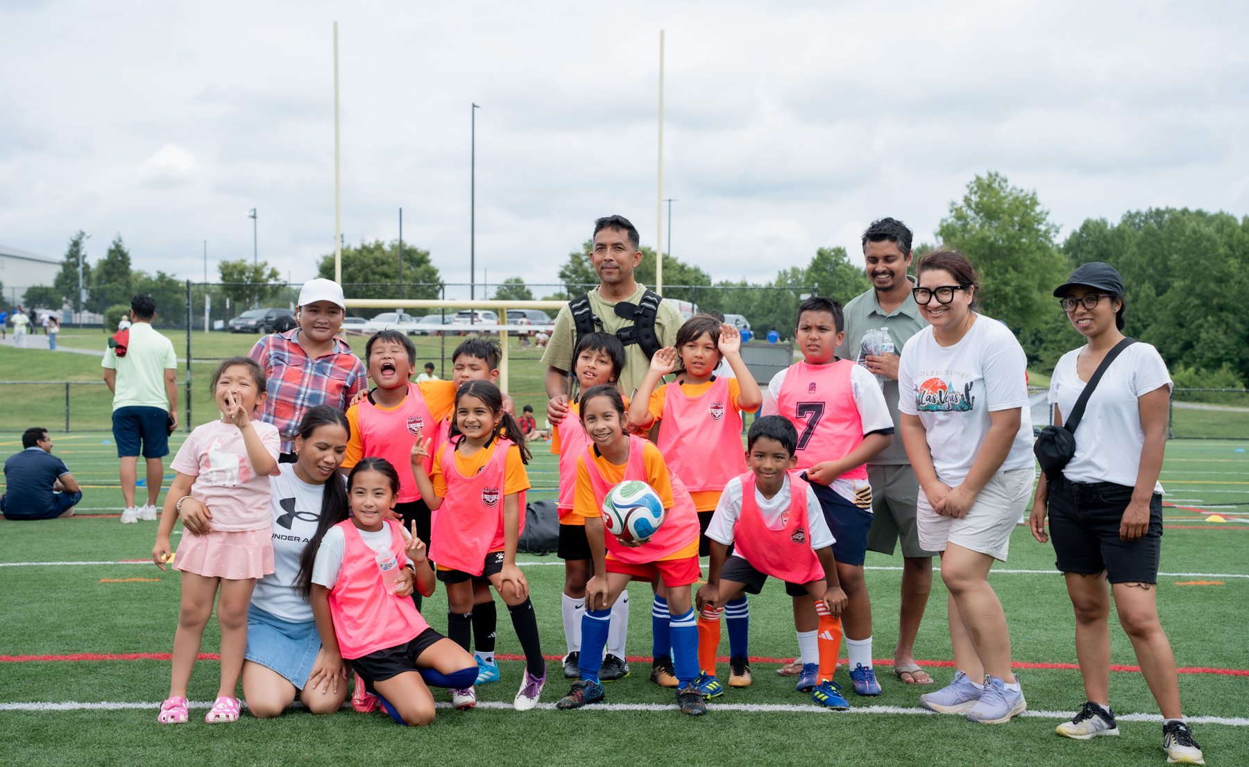 Under-nine champions with families and coaches